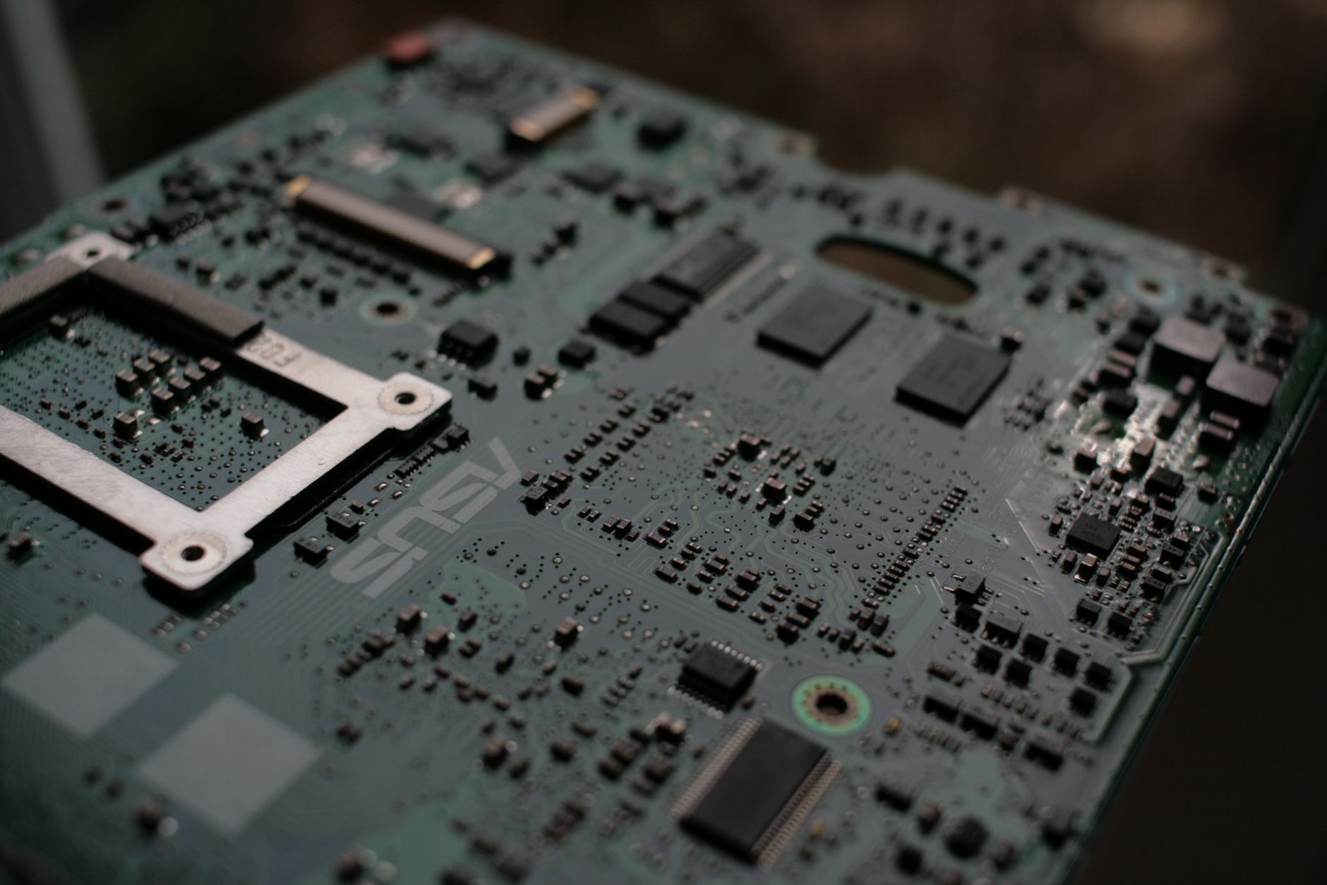 Processors, a graphics card and a water block laid out on the bench