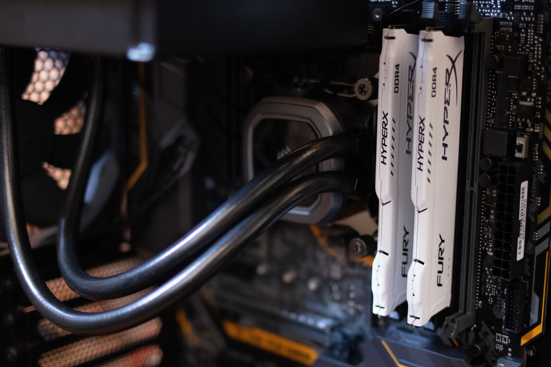 A custom water cooled PC with an RGB distribution plate